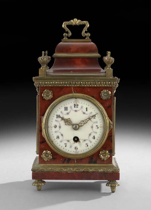 English Tortoiseshell Bracket-Form Boudoir Clock: English Tortoiseshell Bracket-Form Boudoir Clock, ca. 1900, the Louis XIV-style case trimmed in gilt bronze, the works set with an enamel dial decorated with swags of flowers, h. 8-1/2", w. 4-1/4", d.