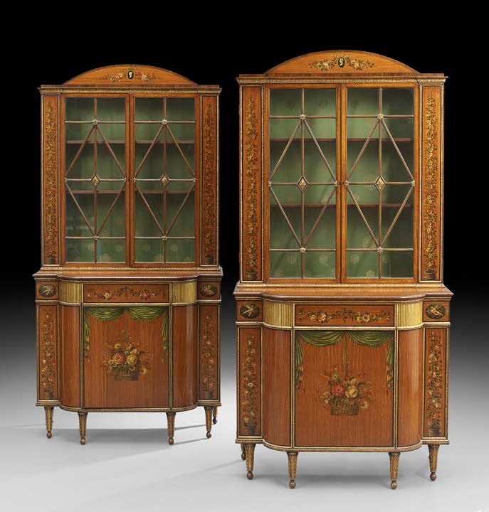 Pair of Edwardian-Style Satinwood Cabinets: Pair of Edwardian-Style Satinwood Cabinets, mid-20th century, each with a domed crest over two astragal-glazed doors, flanked to each side by a paneled upright with a finely painted floral topiary, th