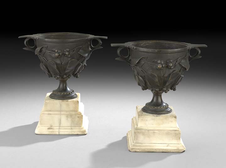 Pair of Renaissance Revival Garniture Urns: Pair of Renaissance Revival Bronze and Marble Garniture Urns, fourth quarter 19th century, probably Italian, the two-handled bronze urns decorated with molded grapes and grape leaves, and raised on st