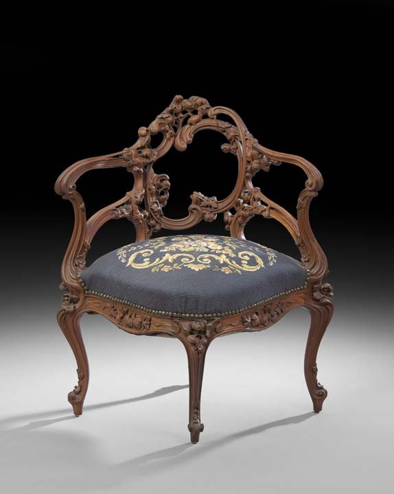 Victorian Mahogany Corner Chair: Victorian Mahogany Corner Chair, late 19th century, the curved and open back with carved floral and scrolling foliate accents, the shaped and padded seat raised on cabriole legs headed by floral carvi