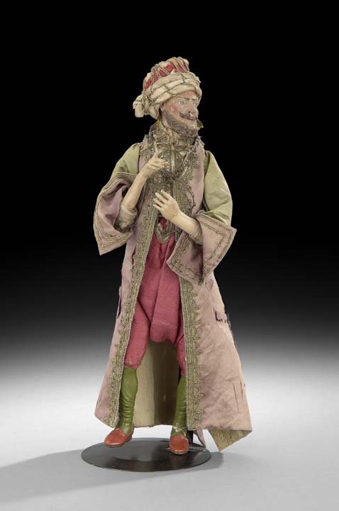 Neapolitan Terracotta Creche Figure of a Magi: Neapolitan Terracotta Creche Figure of a Magi, fourth quarter 19th century, the figure depicted dressed in elaborate polychrome costume with a turban and robe, h. 17", w. 5-1/2", d. 5".