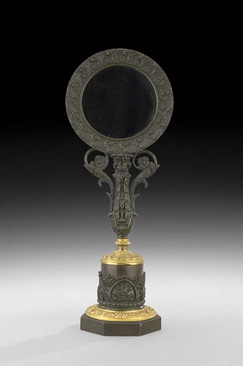 French Restauration Bronze Dressing Mirror: French Restauration Bronze Dore et Patine Dressing Mirror, second quarter 19th century, molded with leaves and Gothic trefoils, the patinated base with contrasting dore mounts and holding a vase-shape