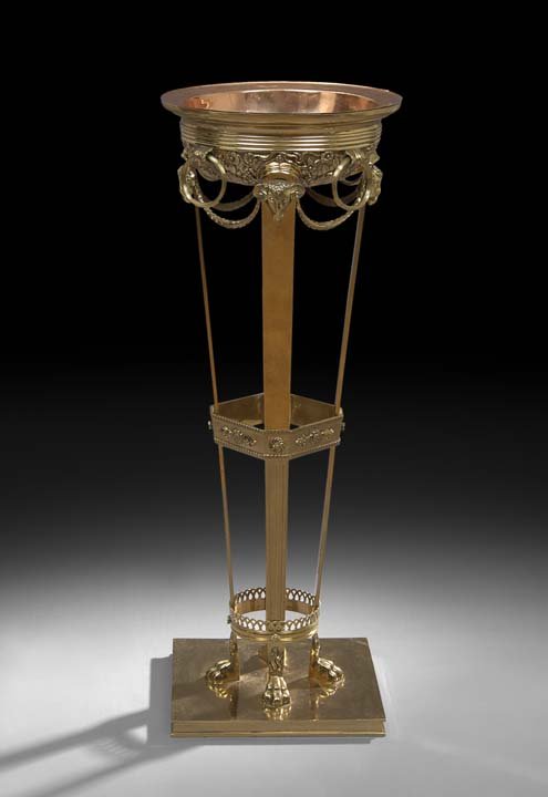 Beaux Arts-Style Bronze and Copper Plant Stand: Beaux Arts-Style Bronze and Copper Plant Stand, fourth quarter 19th century, the flat base holding paw-footed monopodia supports terminating in ram's heads, mounted with rings and swags, and set with 