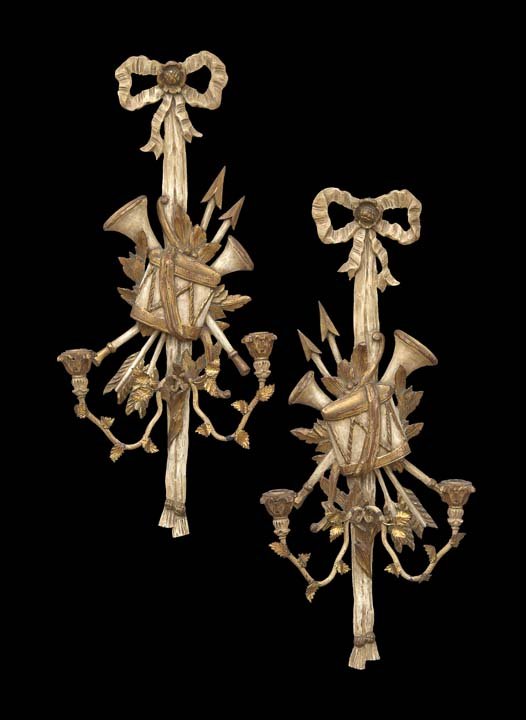 Pair of French Parcel-Gilt Wall Sconces: Pair of French Carved and Parcel-Gilt Wall Sconces, in the Louis XVI taste, the backplates with musical trophies and arrows supported by bowknots, each mounted with two vine-form candle branches decor
