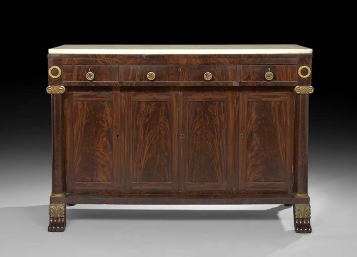 American Late Classical Marble-Top Sideboard: American Late Classical Flame Mahogany and Marble-Top Sideboard, second quarter 19th century, with a projecting frieze fitted with a row of three flatware drawers above a row of four recessed cabinet 