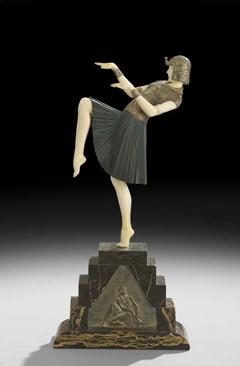 Demetre Chiparus (Romanian/French, 1886-1947): Demetre Chiparus (Romanian/French, 1886-1947), "Nubian Dancer", 1925, patinated bronze figure with ivory head, arms and legs, on a variegated marble stepped pyramid base with Egyptian motif plaque, si