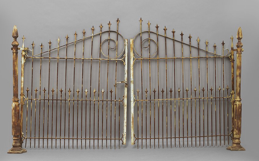 Pair of Cast Iron Drive Gates: Pair of Cast Iron Drive Gates, with fleur-de-lis pickets and cone finials on posts, h. 75-3/4", w. 140".