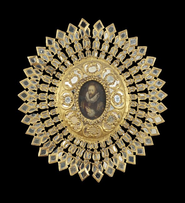 South American Mirrored Starburst Wall Panel: South American Giltwood and Mirrored Starburst Decorative Wall Panel, centered by a Renaissance-style portrait of a man, h. 35", w. 32".