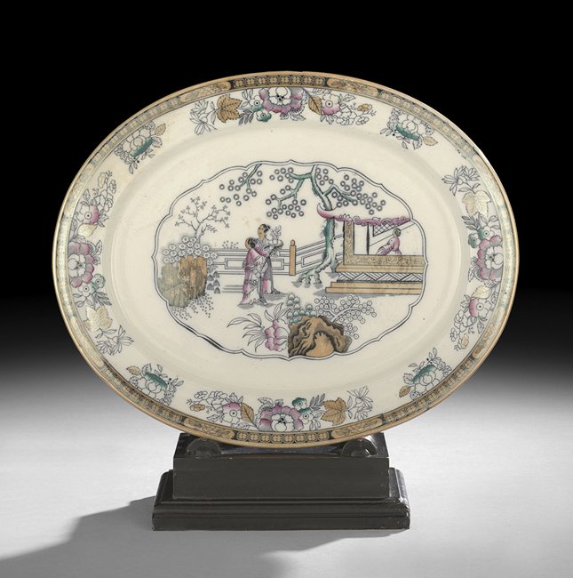 Ironstone Oval Platter in the "Chinese Pattern": Large English Ironstone Oval Platter in the "Chinese Pattern", late 19th century, the rim having a gold lustre border with floral decor, the center field featuring an Asian scene, w. 15", l. 19".