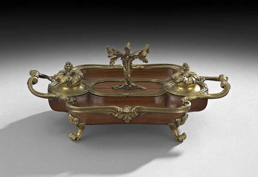 Louis XV-Style Kingwood and Bronze Encrier: Louis XV-Style Kingwood and Bronze Encrier, fourth quarter 19th century, the scrolled bronze feet support the kingwood body, with front and rear pen trays and a pair of bronze inkpots with acanthus le