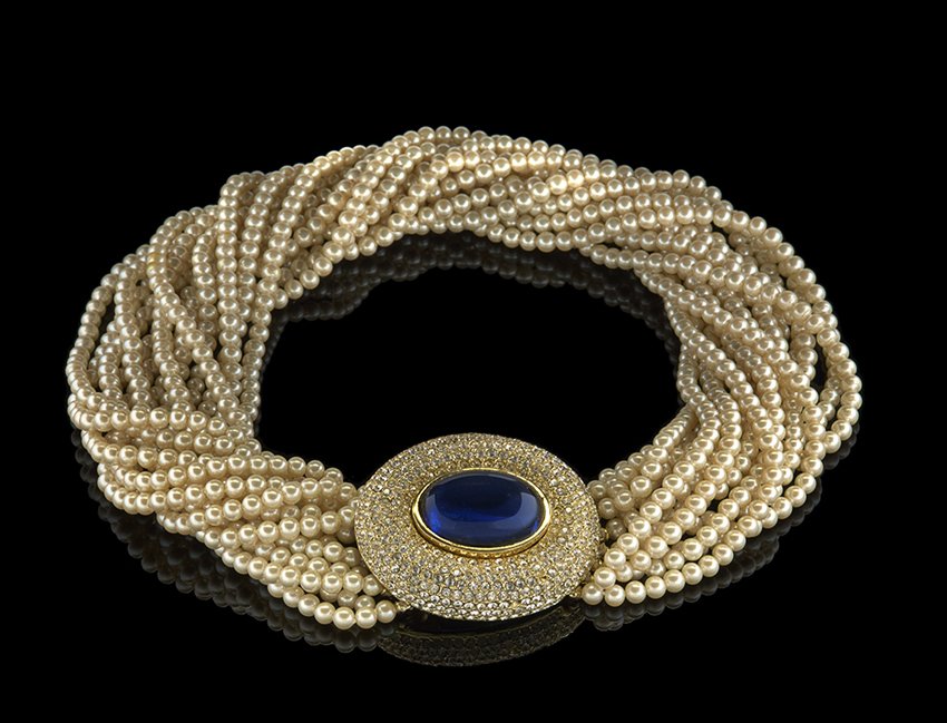 Lady's "Ciner" 14-Strand Simulated Pearl Necklace: Lady's "Ciner" Fourteen-Strand Simulated Pearl Necklace, the gold-tone clasp pave-set with rhinestones surrounding a blue sapphire colored glass oval cabochon, l. 17".