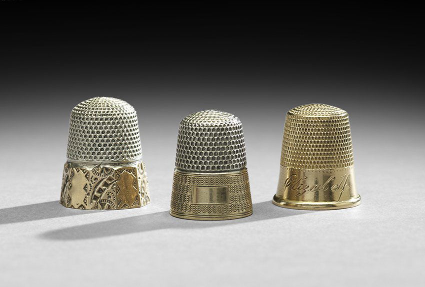 Three Vintage Sterling Silver and Gold Thimbles: Collection of Three Vintage Sterling Silver and Gold Thimbles, first quarter 20th century, including a Simons Brothers example, sterling silver with gold guilloche band, size 9, a Stern Brothers sterl