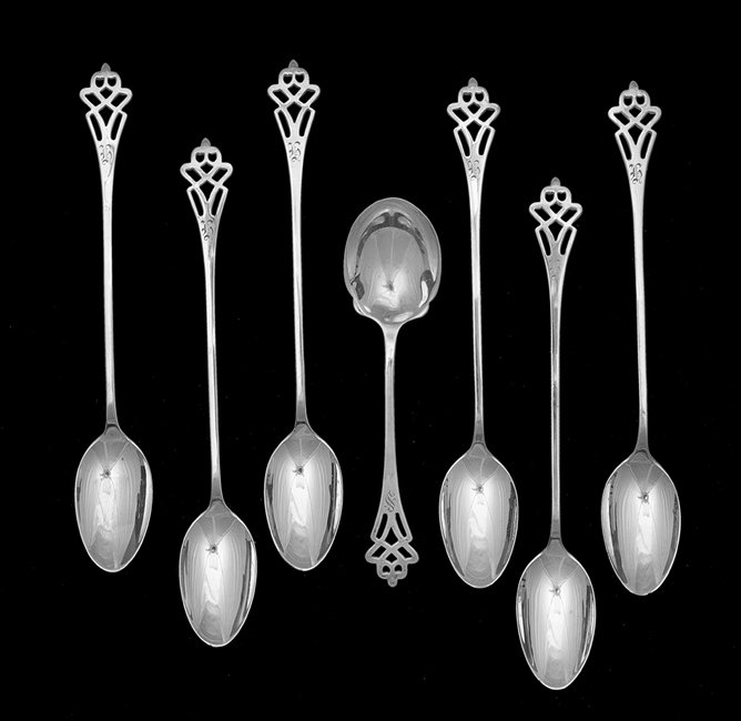 Seven Pieces of Lunt "Pynchon" Silver Flatware: Seven Pieces of Lunt "Pynchon" Sterling Silver Flatware, the pattern introduced ca. 1910, Greenfield, Massachusetts, including six iced tea spoons, l. 7-1/4", and one sugar spoon, l. 5-3/4", variously