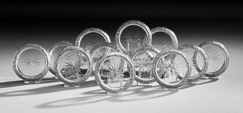 12 Kirk Silver & Glass "Repousse" Drinks Coasters: Set of Twelve Samuel Kirk & Son Sterling Silver and Glass "Repousse" Drinks Coasters, mid-20th century, Baltimore, Maryland, dia. 4".