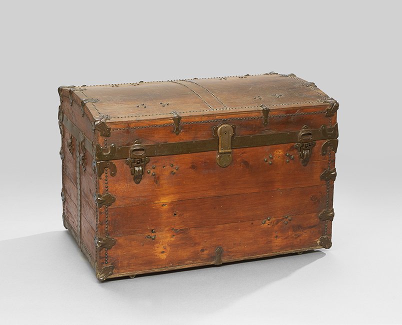 Stained Pine Steamer Trunk: Stained Pine Steamer Trunk, ca. 1900, with slightly domed top and metal strapwork, h. 23-1/2", w. 34", d. 21".