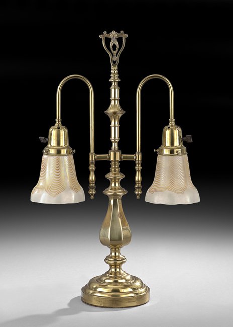Brass Desk Lamp with Steuben-Style Shades: American Brass Two-Light Desk Lamp with Steuben-Style Shades, first quarter 20th century, the shades bearing spurious signatures, h. 23-3/4", w. 16-1/2", d. 5-1/4".