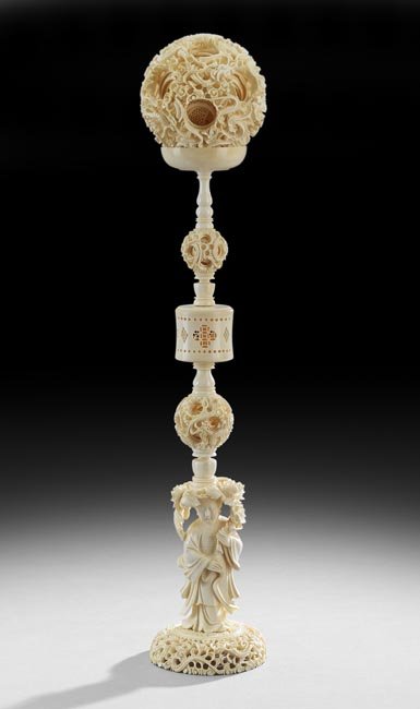 Chinese Finely-Carved Ivory Puzzle Ball: Chinese Finely-Carved Ivory Puzzle Ball, late Qing Dynasty (1644-1911), the pierced and carved ivory puzzle ball with a motif of interweaving clouds and dragons on a stand with two smaller carved and 