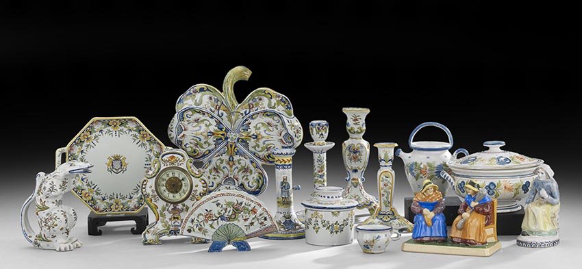 Fifteen-Piece Collection of French Faience: Fifteen-Piece Collection of French Faience, late19th/early 20th century, including a clock in the rococo taste, a butter bell, a crocodile-form figural jug and various other pieces of pottery, h. 2" t