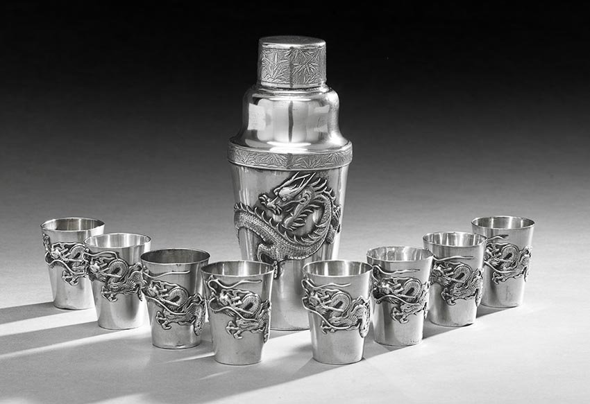 Nine-Piece Chinese Export Silver Cocktail Set: Assembled Nine-Piece Chinese Export Silver Cocktail Set, first quarter 20th century, including a cocktail shaker by Wang Hing, Canton and Shanghai, of tapering cylindrical form with applied dragon and