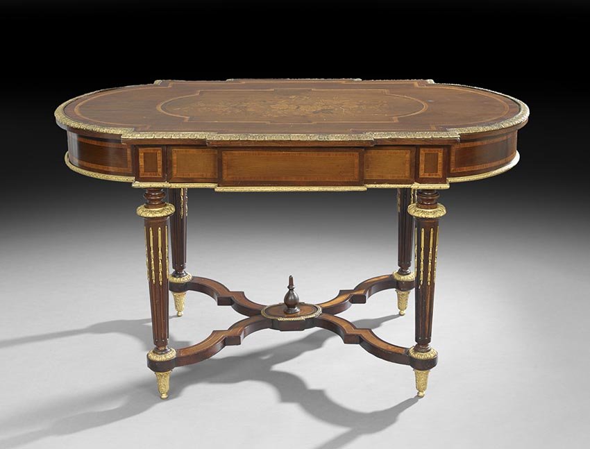 Louis XVI-Style Center Table: Louis XVI-Style Mahogany and Kingwood Center Table, mid-19th century, the turtle-form top banded and centered by a foliate inlay, within an ormolu edging, above a conforming paneled frieze fitted with
