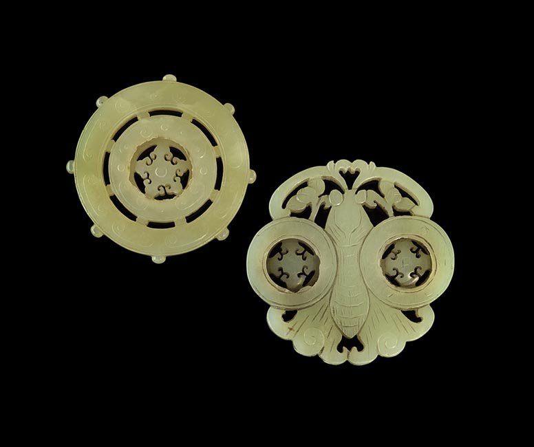 Two Chinese Jade Pendants with Moving Wheels: Two Chinese Jade Pendants with Moving Carved Wheels, 18th and 19th century respectively, one in the form of a Buddhist prayer wheel in two concentric circles, and the other in the shape of a moth with