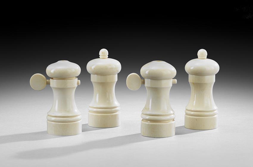Two Pairs of Ivory Salt & Pepper Grinders: Two Sets of Matching Turned Ivory Pepper Grinds and Salt Shakers, 20th century, h. 4-1/4", dia. 2" (four total pieces).