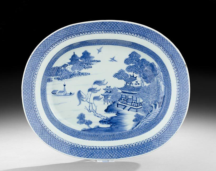 Chinese Blue and White Platter: Chinese Blue and White Platter, Qing Dynasty (1644-1911), probably 19th century, the large Nanking dish with lancelet borders, the center depicting a landscape with boats and pavilions, unmarked, w. 1