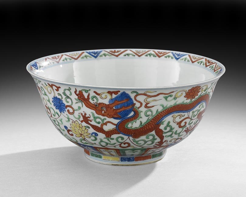 Chinese Doucai Dragon Bowl: Chinese Doucai Dragon Bowl, 19th/20th century, the bowl with an image of a dragon running through a ground of scrolling vines and flowers, the underside marked with a Ming period Jiajing mark, h. 3-3/