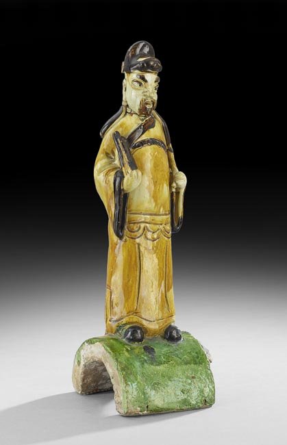 Chinese Roof Tile: Chinese Roof Tile, Ming Dynasty (1368-1644), the pottery roof tile with a figure of an official in a green, brown and amber sancai glaze, h. 16-1/2".