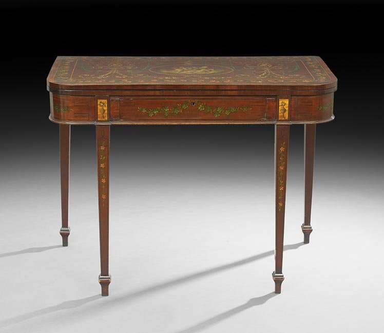 Edwardian Mahogany Games Table: Edwardian Mahogany Games Table, ca. 1900, the rounded rectangular hinged top centered by an oval medallion of cavorting cherubs within various polychrome designs in the Adam taste, opening to a floral