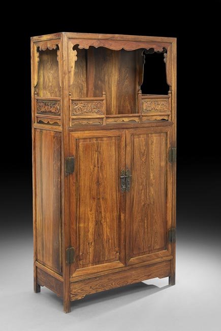 Chinese Huang Huali Cabinet: Chinese Huang Huali Cabinet, 19th century, the cabinet featuring an altar shelf with sides decorated with a scrolling dragon motif, the doors with a bolt closure and containing two drawers, h. 71", w.