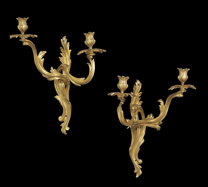 Pair of French Belle Epoque Bronze Sconces: Pair of French Belle Epoque Bronze Two-Light Sconces, ca. 1900, in the Louis XV taste, with leaf-molded backplates and matching candle branches, cups and drip pans, h. 18", w. 13-1/4", d. 10".