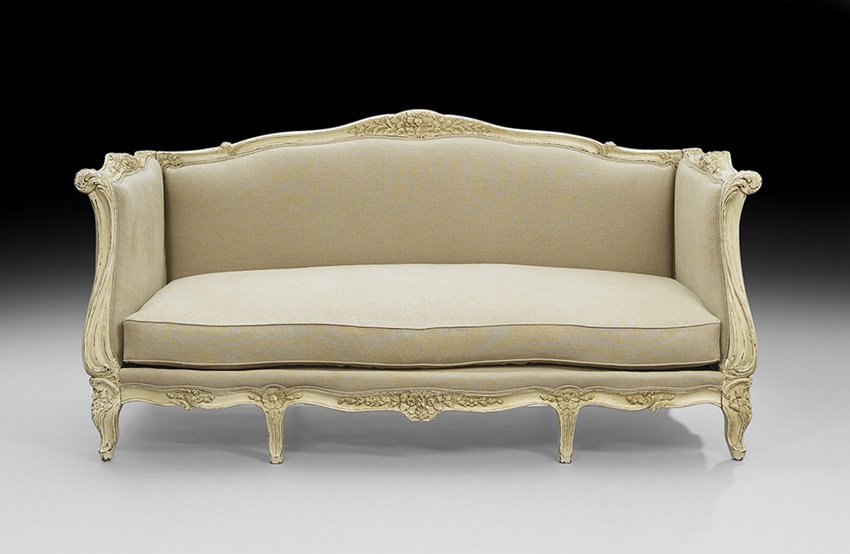 Louis XV-Style Polychromed Settee: Louis XV-Style Polychromed Settee, of box form, the shaped and padded back and sides surmounted by a floral-carved crest, the cushioned seat raised on shaped molded legs headed by floral carving and e