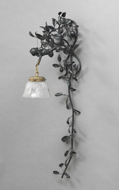Art Nouveau-Style Enameled Metal and Brass Sconce: Unusual Art Nouveau-Style Enameled Metal and Brass Sconce, first quarter 20th century, probably Italian, the lemon tree-form backplate supporting a putto holding the brass fixture, mounted with an etc