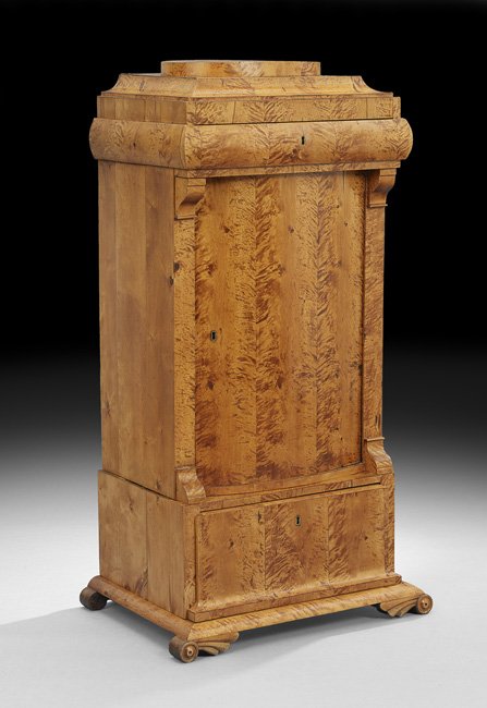 Biedermeier Birchwood Pedestal Cabinet: Biedermeier Birchwood Pedestal Cabinet, mid-19th century, the stepped top above a case fitted with a rounded drawer over a bowed cupboard door, with a single deep drawer below, raised on circular feet