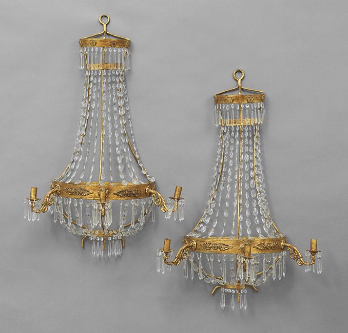Pair of French Gilt-Metal and Crystal Sconces: Unusual Pair of French Gilt-Metal and Crystal Three-Light Sconces, mid-20th century, in the Louis XVI taste, of basket form, with swags of prisms from the upper tier to the molded candle arm support, 