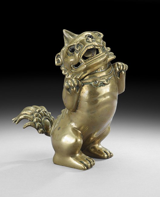 Chinese Paktong Foo Dog Censer: Chinese Paktong Foo Dog Censer, probably 19th century, the figure of a foo dog with inlaid eyes and the character "Wang" or king on its forehead, standing on back legs with front paws raised, h. 10-1/