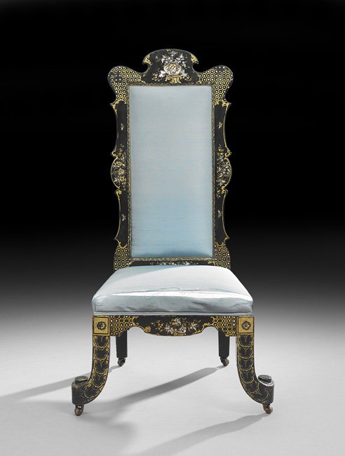 Victorian Ebonized Slipper Chair: Victorian Ebonized Slipper Chair, third quarter 19th century, the padded rectangular back within a shaped frame with a rounded crest, the padded seat raised on out-scrolled legs on casters, the whole 