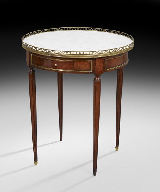 Louis XVI-Style Marble-Top Bouillotte Table: Louis XVI-Style Mahogany and Marble-Top Bouillotte Table, late 19th century, the circular Carrara marble top within a full pierced brass gallery and above a conforming frieze fitted with two candle sl