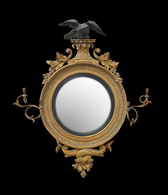 Exceptional Large English Regency Convex Mirror: Exceptional Large English Regency Convex Mirror, first quarter 19th century, intertwined dolphins support the leaf-molded and coved frame, set with a pair of two-light candle branches with period bron