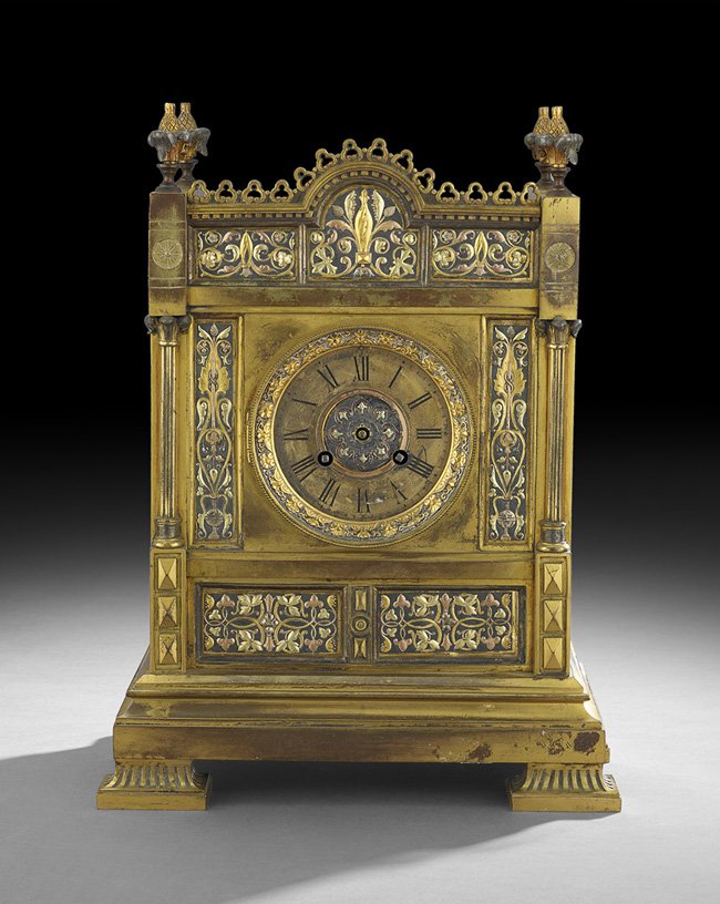 English Design Reform Movement Mantel Clock: English Design Reform Movement Gilt-Bronze Mantel Clock, fourth quarter 19th century, decorated with various colored lacquers to mimic mixed metal work, the dial marked by the retailer, W&M Dodge, Man