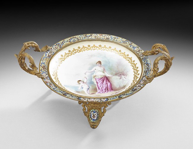 French Bronze, Enamel and Porcelain Centerpiece: French Belle Epoque Gilt-Bronze, Champleve Enamel and Porcelain Centerpiece, ca. 1900, the Louis XV-style mounts decorated with enamel trim, mounted with a Sevres-style dish decorated with a hand-pain
