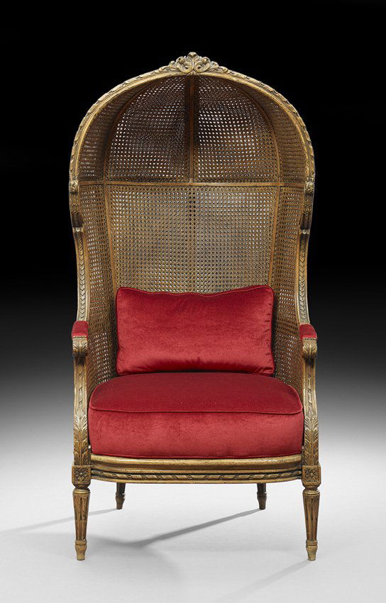 Louis XVI-Style Fruitwood Porter's Chair: Louis XVI-Style Fruitwood Porter's Chair, 20th century, of traditional form, the domed back and sides double-caned and joined to the caned and cushioned seat by padded foliate-carved arms, raised on s