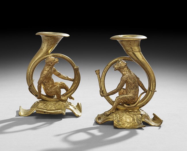 Unusual Pair of Gilt-Bronze Figural Candlesticks: Unusual Pair of Gilt-Bronze Figural Candlesticks, ca. 1900, probably French, the bases in the form of folded sheet music supporting gilded monkeys, sitting astride horns set with candle cups, h. 5-1/2