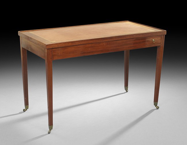 Directoire-Style Mahogany Games Table: Directoire-Style Mahogany Games Table, 19th century, the rectangular top with raised edge and inset leather surface, removing and reversing to a baize-lined surface, revealing an ebonized recessed bac