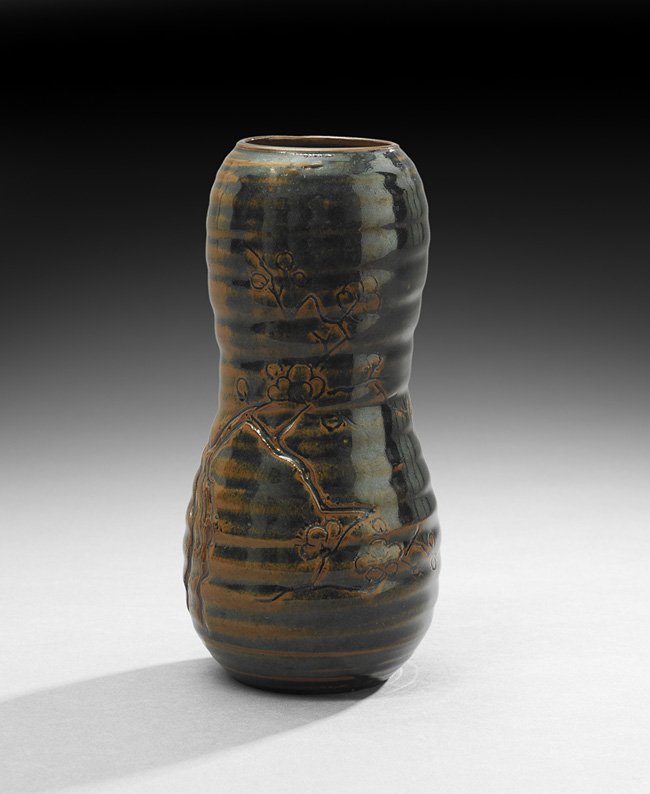 Japanese Takatori Ware Vase: Japanese Takatori Ware Vase, Edo period (1615-1868), probably 18th century, the small gourd-shaped brown and black glazed vessel with flowering prunus limbs, h. 8-3/4", dia. 3-5/8". The Takatori kilns