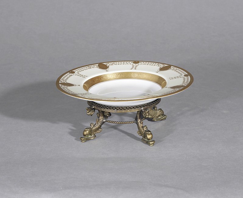 Tiffany-Retailed Minton Bronze & Porcelain Tazza: Tiffany-Retailed Minton Bronze and Raised-Gilt Porcelain Tazza, first quarter 20th century, English, the date letter observed on the base, h. 3-1/4", dia. 9".