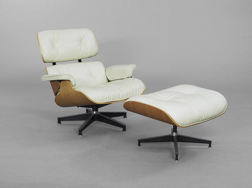 Chas. & Ray Eames for Herman Miller Lounge Chair: Charles and Ray Eames for Herman Miller Lounge Chair, model 670, the laminated and ivory leather lounge chair and ottoman each retaining a Herman Miller label, chair, h. 31", w. 34", d. 34", ottoman, 