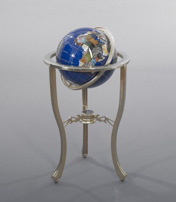 Unusual Faux Enamel Globe on Metal Stand: Unusual Faux Enamel Globe on Metal Stand, the various countries and states picked out in specimen stone and mother-of-pearl, the base set with a compass, h. 34", dia. 19".
