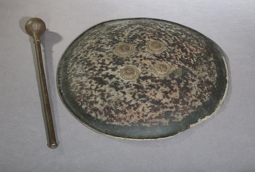 Indo-Persian Mace and Shield/Buckler: Indo-Persian Mace and Shield/Buckler, mid-19th century, the mace with a pyriform head chiseled with twelve panels and topped by a small turned finial, separated by a simple knop from the similarly pan